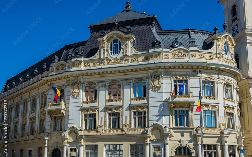 Obraz premium City Hall building and Tower of Jesuit Church of Holy Trinity in Old Town of Sibiu, Romania