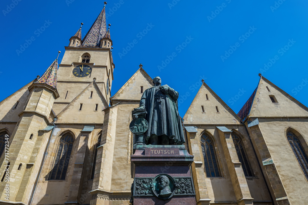 Monument of Bishop Georg Daniel Teutsch in front of Lutheran Cathedral of St Mary in Old Town of Sibiu, Romania Monument of Bishop Georg Daniel Teutsch in front of Lutheran Cathedral of St Mary in Old Town of Sibiu, Romania