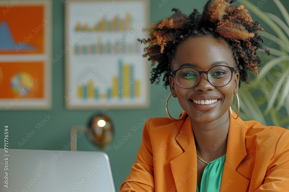 Portrait of a young cheerful African American woman in bright business ...