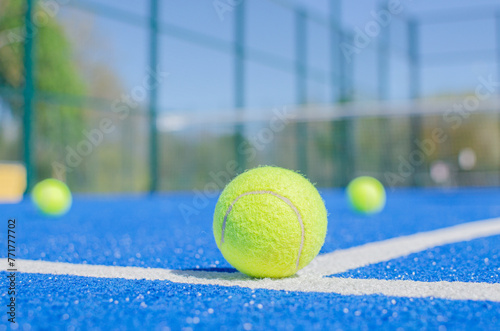 surface view of a blue paddle tennis court, racket sports concept
