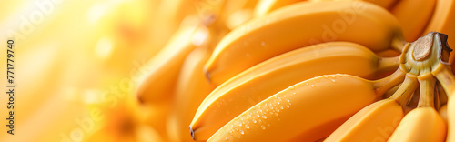 Dew-Kissed Bananas in Soft Light - Close-up banner of a bunch of ripe bananas, vibrant yellow background with fresh dewdrops, in soft, golden light photo