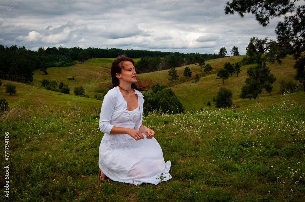 Carpathians mountain girl. Woman in windy valley. Woman in the mountain valley. Landscape of summer nature. Beautiful girl at nature valley outdoor. Freedom lifestyle. Wedding dress Carpathians mountain girl. Woman in windy valley. Woman in the mountain valley. Landscape of summer nature. Beautiful girl at nature valley outdoor. Freedom lifestyle. Wedding dress