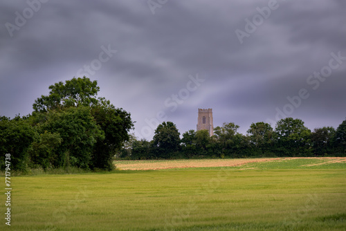 Walking in North Norflok in pring, view of the church of All Saints, Walcott