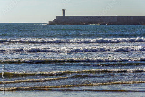 Port of Leixoes breakwater, view from Atlantic Ocean beach in Matosinhos, Portugal photo