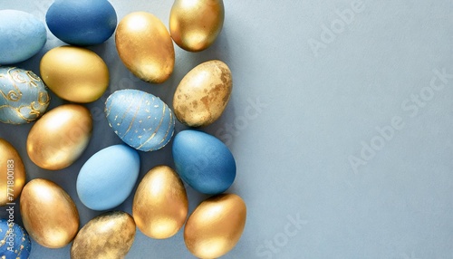 gold and blue easter eggs on a blue background easter frame of eggs painted in blue gold color flat lay top view copy space for text