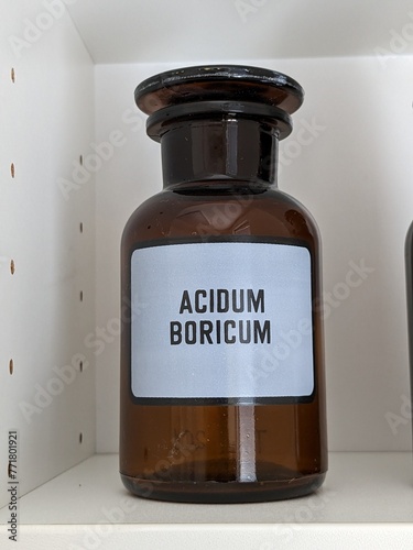 Old fashioned medicine glass bottles,brown vintage pharmacy bottles for medicinal substances-Acidum boricum photo