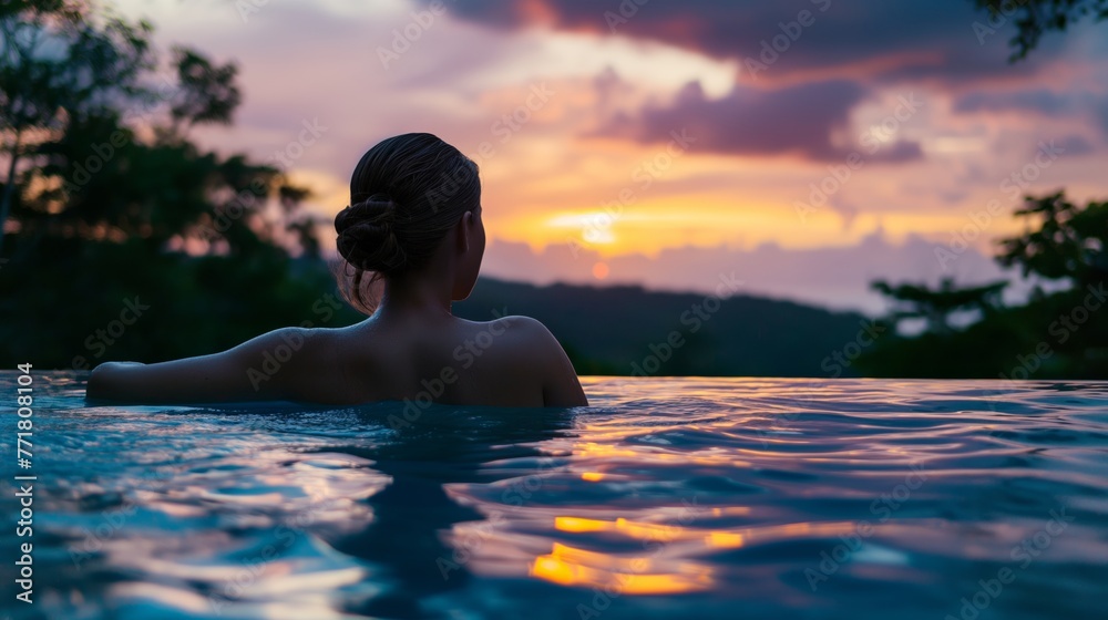Woman enjoying a spa pool at twilight. Rest after hard working days Woman enjoying a spa pool at twilight. Rest after hard working days