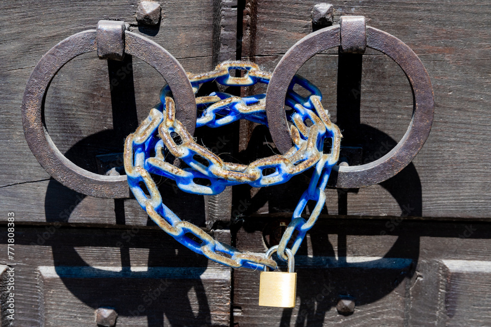 Weathered Iron Rings with Blue Chain and Padlock