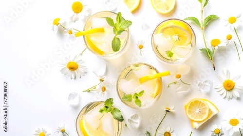 Refreshing summer lemonade with lemon slices  mint leaves on white background. Perfect for a hot day. Made with fresh lemons  mint  cane sugar. Perfect to quench thirst.