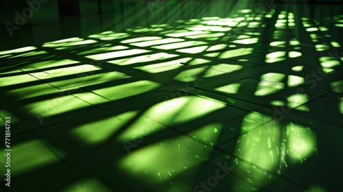 Green light patterns on floor creating abstract art. Geometric shadows and lights on a tiled surface. Contemporary green lighting over floor tiles creating dynamic shapes.