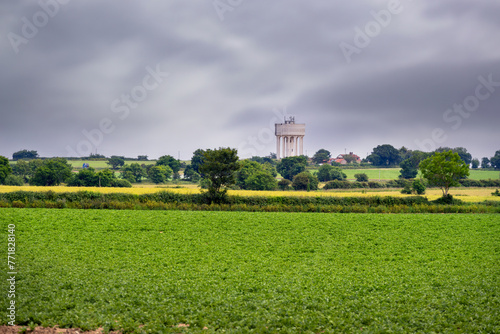 View of a water tower near Happisburgh in the middle of fields in spring, North Norfolk, England