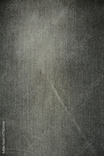 Faded gray denim background closeup