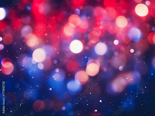 Red and blue hues blend in defocused Christmas backdrop.