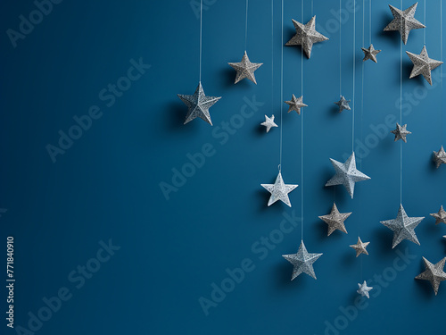 Star shapes adorn a blue background in a composite for Christmas designs. photo