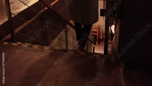 Young girl is going down the stairs