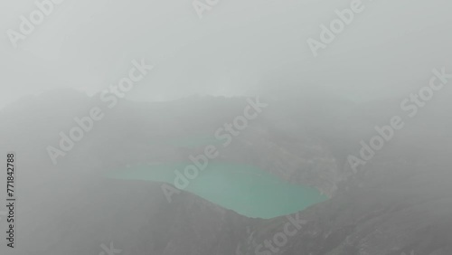 Aerial view of the turquoise crater of Mount Kelimutu