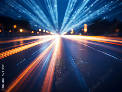 Blurred lights on the road form an abstract color background.
