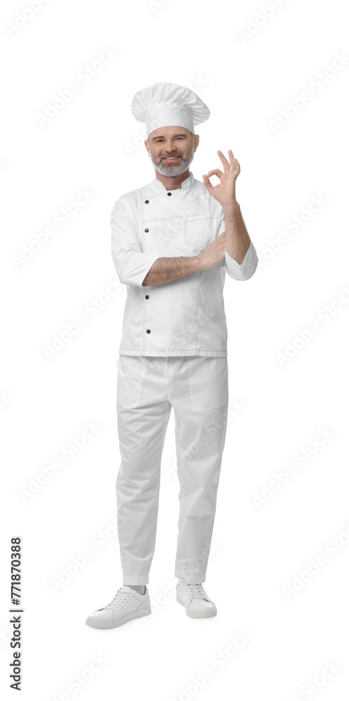 Happy chef in uniform showing OK gesture on white background Happy chef in uniform showing OK gesture on white background