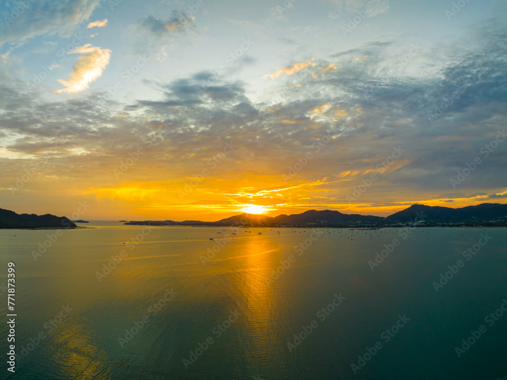 Aerial view sunset sky, Beautiful Light Sunset or sunrise over sea,Colorful dramatic majestic scenery sunset Sky, Amazing clouds and small waves in the ocean, Wonderful light cloud background