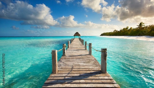 Old wooden pier over tropical waters photo