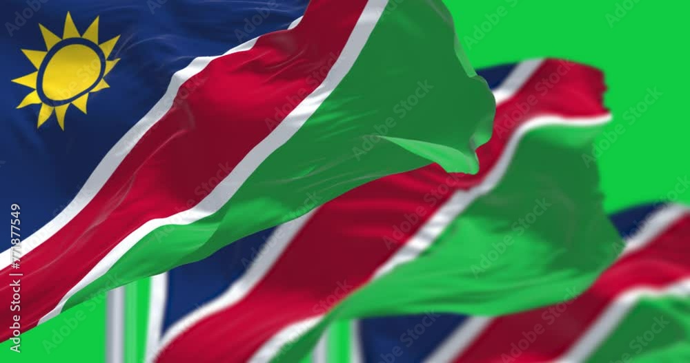 Namibia national flags waving isolated on green background