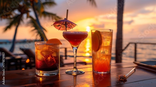 Summer cocktails on a luxury tropical beach resort at sunset.