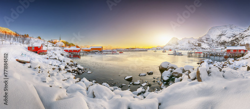 Amazing winter scenery of Moskenes village with ferryport and famous Moskenes parish Churc photo
