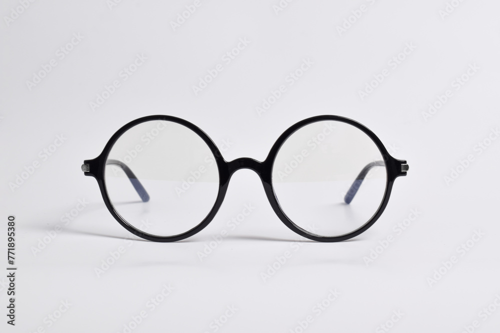 Stylish glasses with round black frames isolated on white background. anti-UV glasses Stylish glasses with round black frames isolated on white background. anti-UV glasses