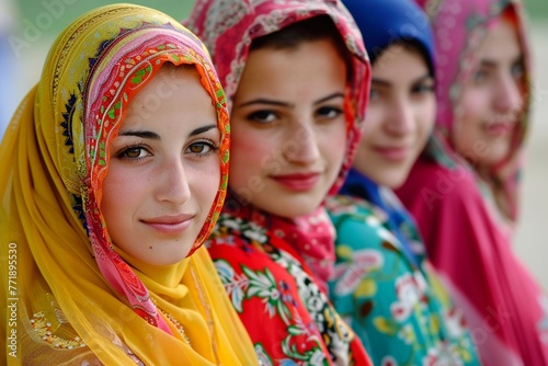 A group of beautiful women in colorful traditional headscarves representing cultural diversity.
