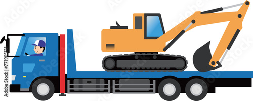 ショベルカーを積載したセルフローダーを運転する男性