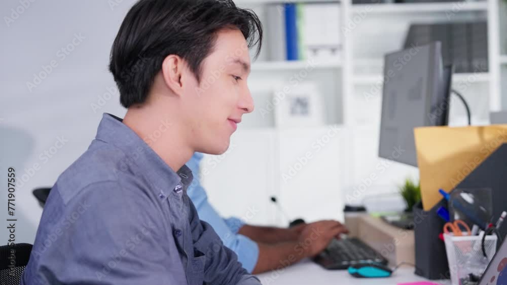Portrait of attractive young Asian businessman smiling in office on desk workspace. man confident. Emotions happy. business worker Portrait of attractive young Asian businessman smiling in office on desk workspace. man confident. Emotions happy. business worker