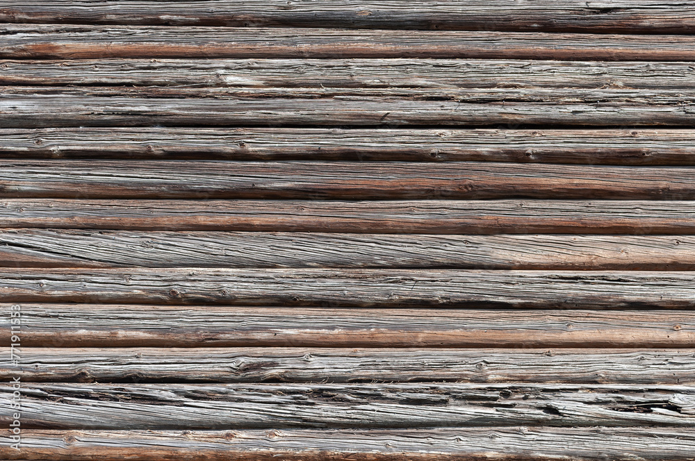 Texture of weathered wooden log wall of old country house Texture of weathered wooden log wall of old country house