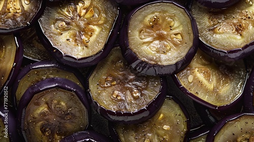 Sliced eggplant, ready to be grilled, roasted, or saut?(C)ed to perfection for a savory dish.