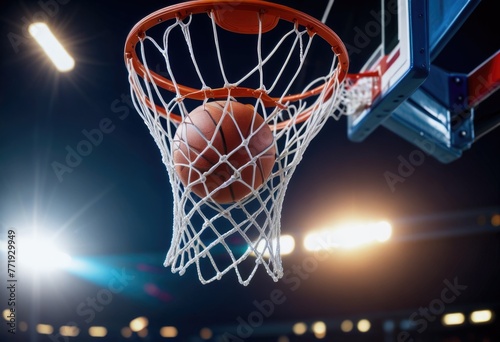 A basketball sails through the air, swooshing into the hoop on the basketball court with precision