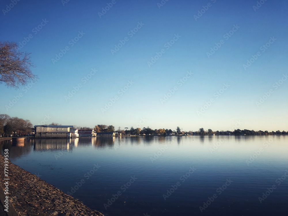 Fototapeta premium Lake Wendouree Boat Sheds still water on a blue sky day in Ballarat