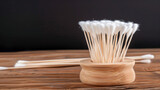 Cotton swabs on a wooden base for the ears close-up isolated