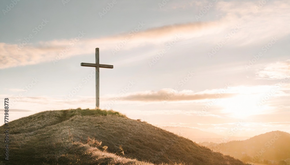 cross on a hill with a sunset easter background with copy space for text