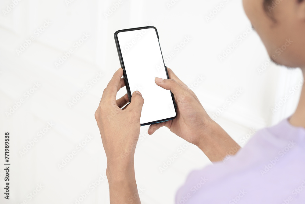 closeup, white screen of mobile phone in human hand, 