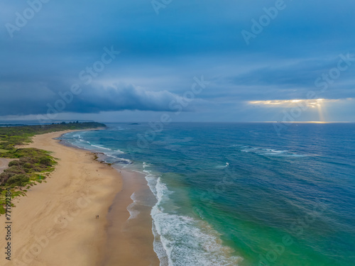 Fototapeta Naklejka Na Ścianę i Meble -  Sunrise Seascape with beautiful cloud covered sky and gentle surf