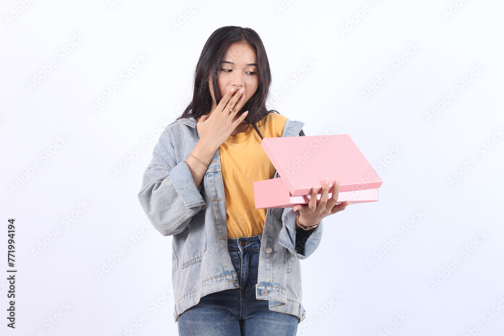 Happy excited, Asian young woman opening gift box isolated on white background. Receiving gifts from lovers. Anniversary, valentine New Year or Christmas concept
