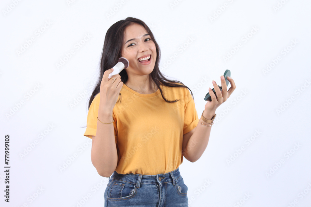 Beautiful Asian woman use brush and power wear make up look in the mirror, Portrait of fashion woman with cosmetic concept on white background. Beautiful Asian woman use brush and power wear make up look in the mirror, Portrait of fashion woman with cosmetic concept on white background.