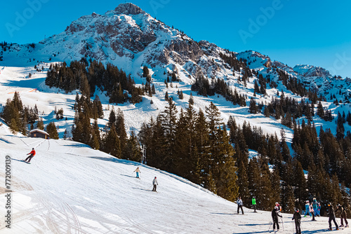 Alpine winter view with ski drivers at Mount Fuessener Joechle, Graen, Reutte, Tyrol, Austria photo