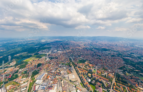 Turin, Italy. Panorama of the city in summer. Industrial and residential areas. Fields. Aerial view