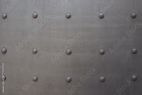 Fortress metal door with rivets. Old medieval castle in Kotor, Montenegro. Entrance to the fortress. Wrought iron door with pattern. Medieval style with rivets of steel. Beautiful stylish gothic door