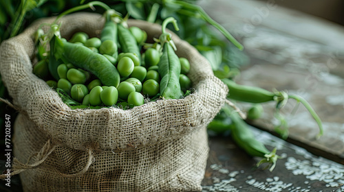 
A harvest of freshly picked green peas is displayed on a rustic wooden background, showcasing the bounty of the season
