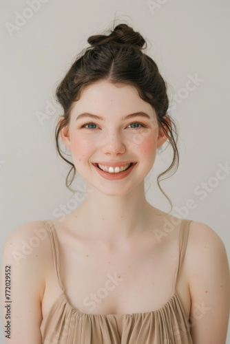Charming woman with a joyful expression on her face  smiling confidently
