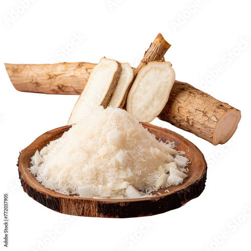 Wooden bowl of shredded horseradish next to roots, key ingredient for cooking on a transparent background photo