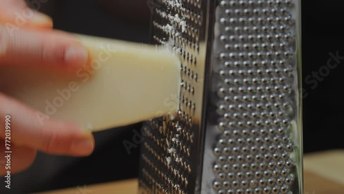Cheese. Parmesan. Grate the cheese. Hard cheese. Cooking. Italian cuisine. Cooking. Close-up. Yellow cheese. High quality 4k footage