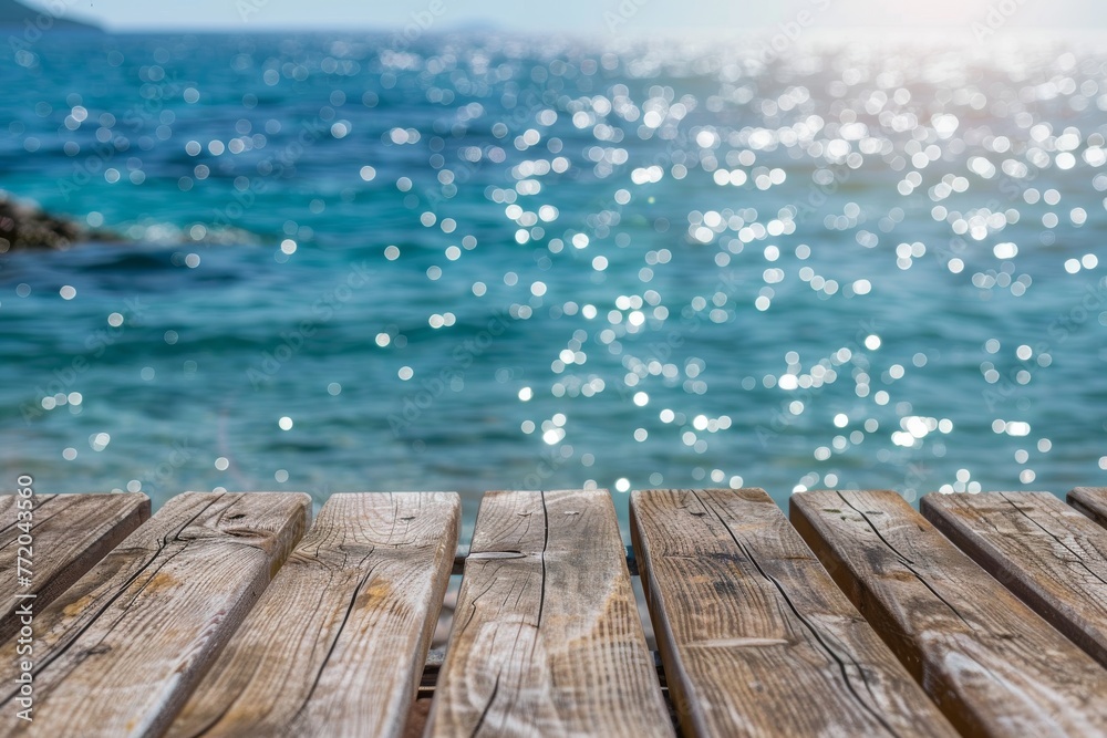 wooden table with blur sparkling sea water background space banner display or montage your products.