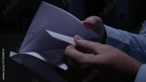 Blurred Shooting with a Person Opening an Envelope and Reading a Letter. Businessman Receiving a Document by Postage.